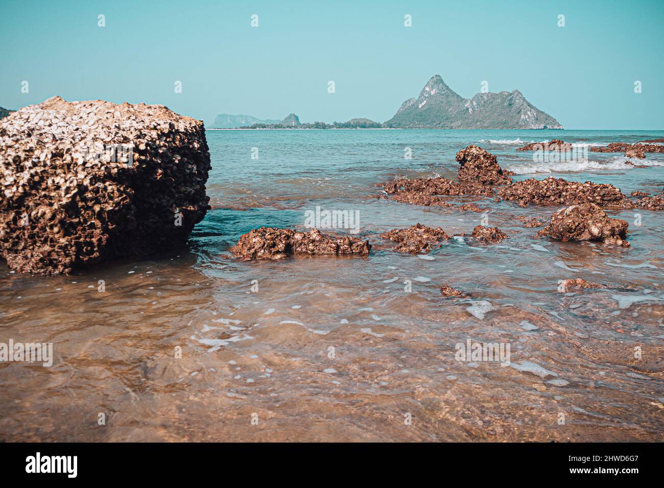 Beach rock horizon scenics Calm sea blue water ocean blue sky Stock ...