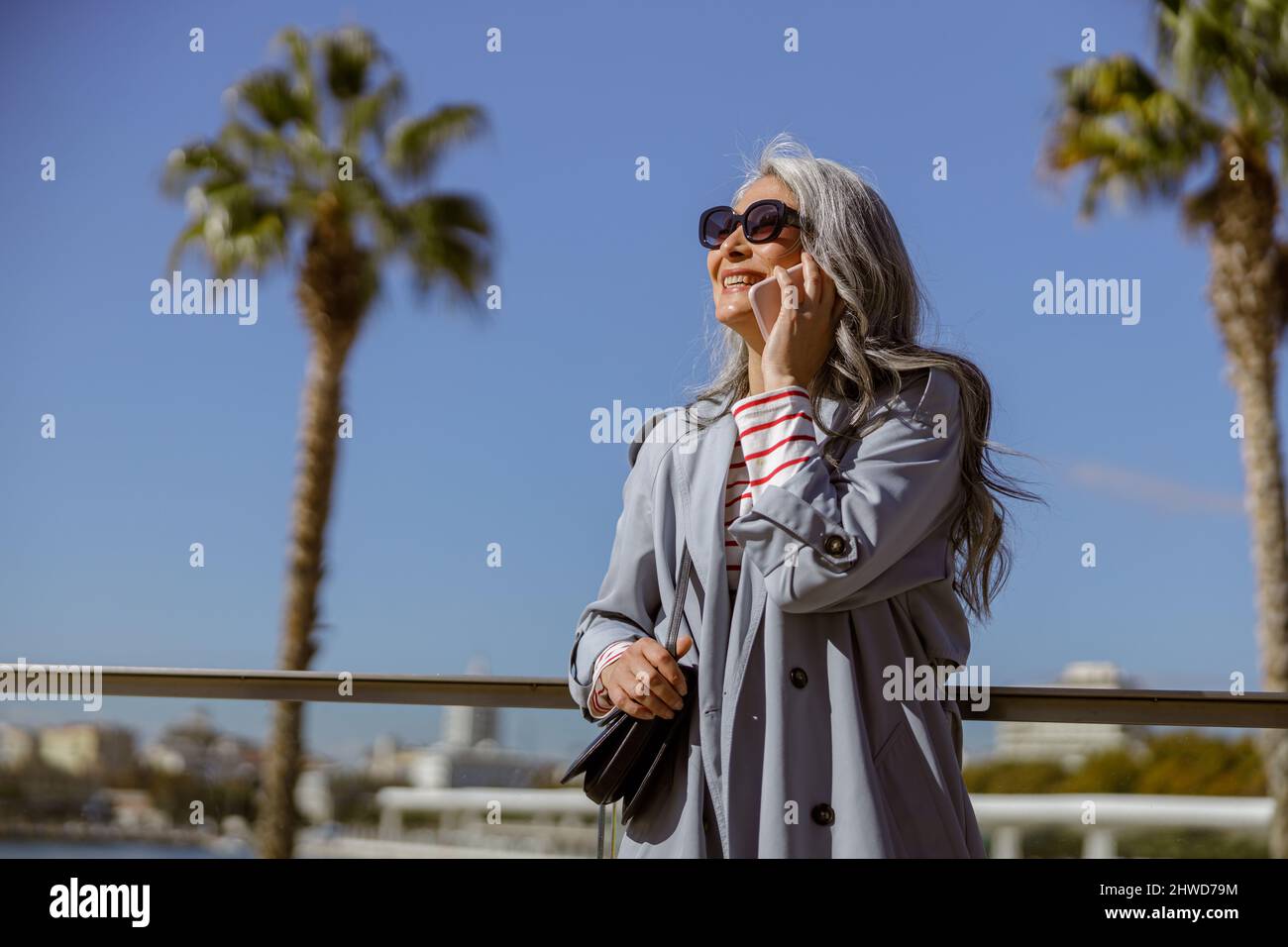 Modern mature woman standing hi-res stock photography and images - Alamy