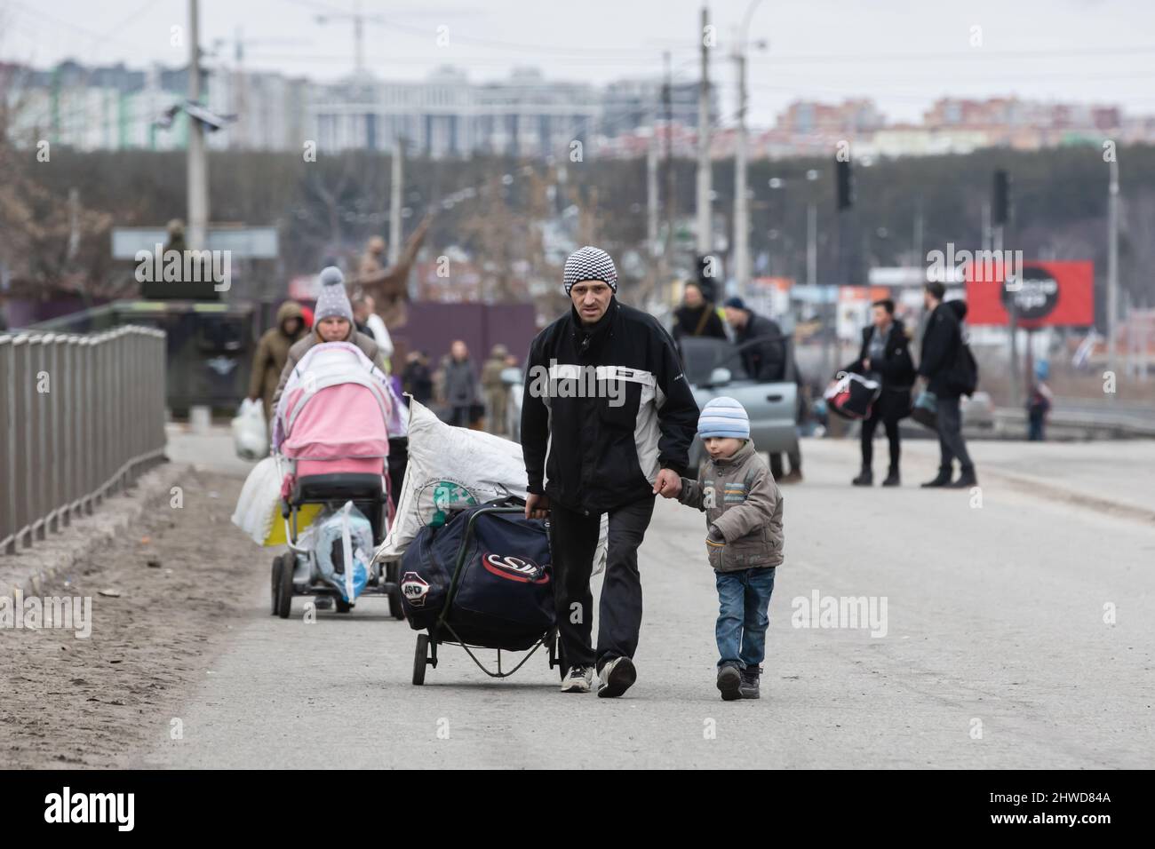 IRPIN, UKRAINE - Mar. 05, 2022: War of Russia against Ukraine. Women, old people and children evacuated from Irpin town was transferd to Kyiv by Kyiv territorial defense battalion. War refugees in Ukraine Credit: Mykhailo Palinchak/Alamy Live News Stock Photo