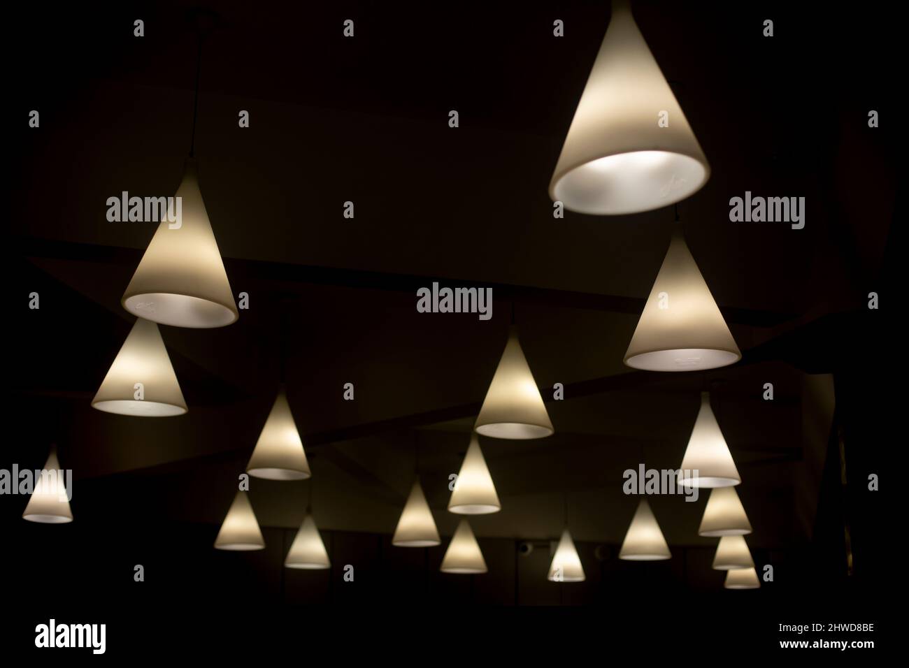 Lots of lamps on ceiling. Interior details. Light sources in room