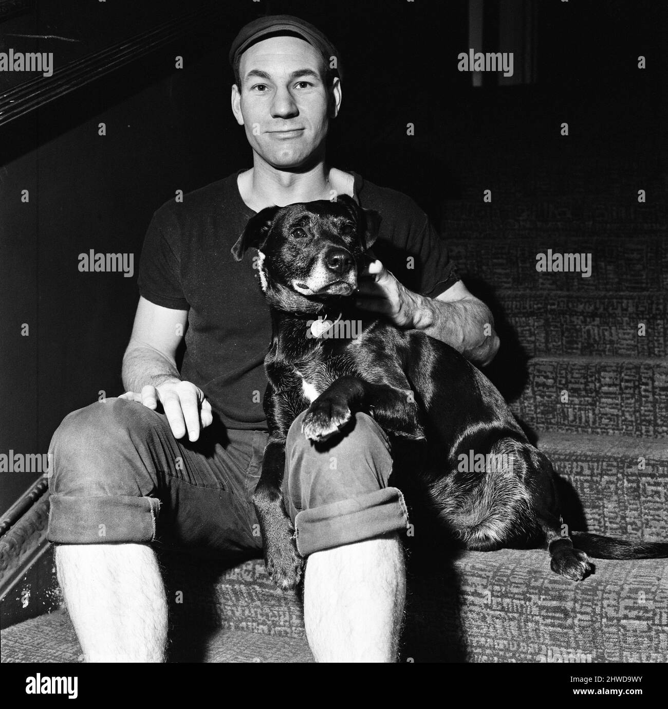 Patrick Stewart, who is starring as Launce in The Royal Shakespeare Company's production of The Two Gentlemen of Verona, with Blackie, a dog rescued in Leamington Spa by the Avon Dog Rescue Service. Blackie was immediately cast for the role of Crab, who has an important relationship in the play with Launce. 21st December 1970. Stock Photo