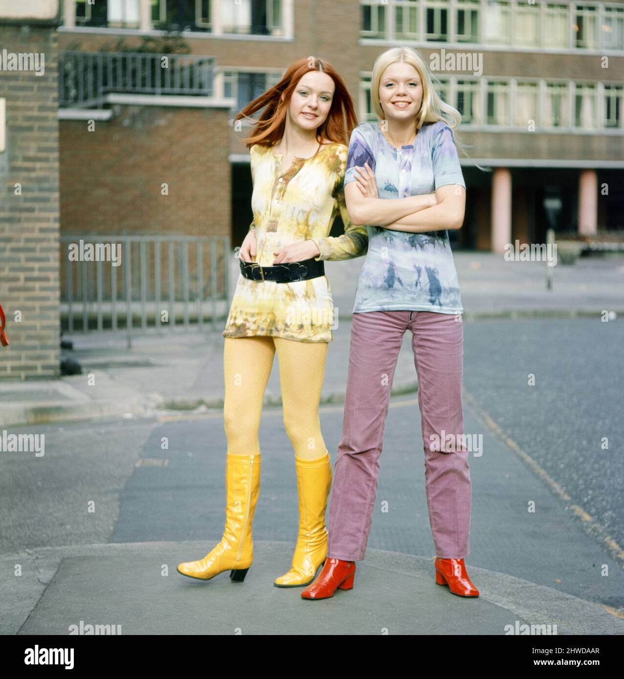 Tie-dye shirts worn by models, Jane (red hair) and Linda (blond hair). 3rd March 1970. Stock Photo