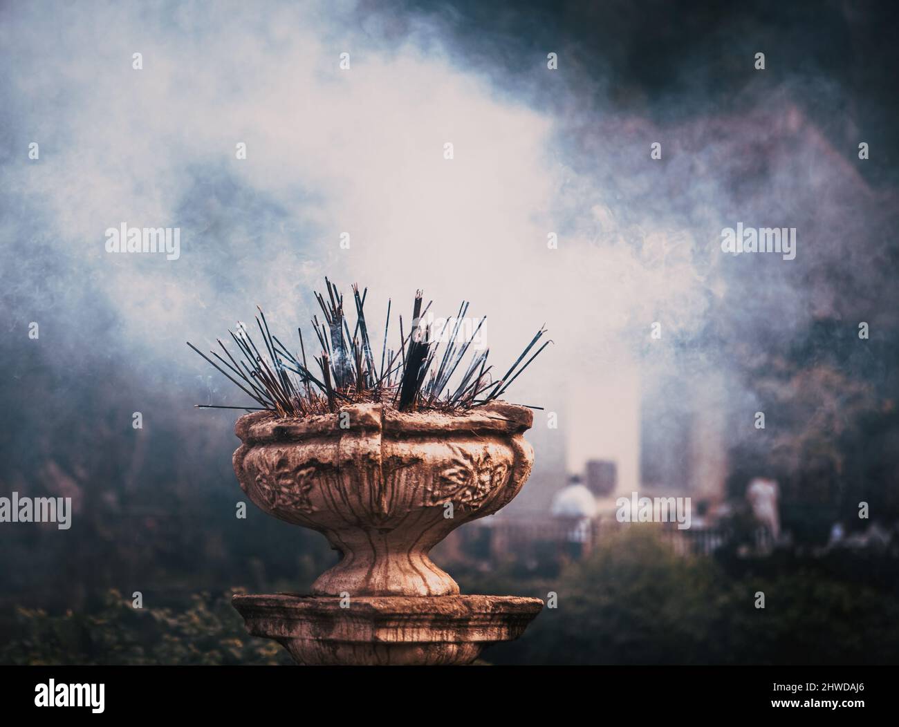 burning incense sticks and people praying Stock Photo Alamy
