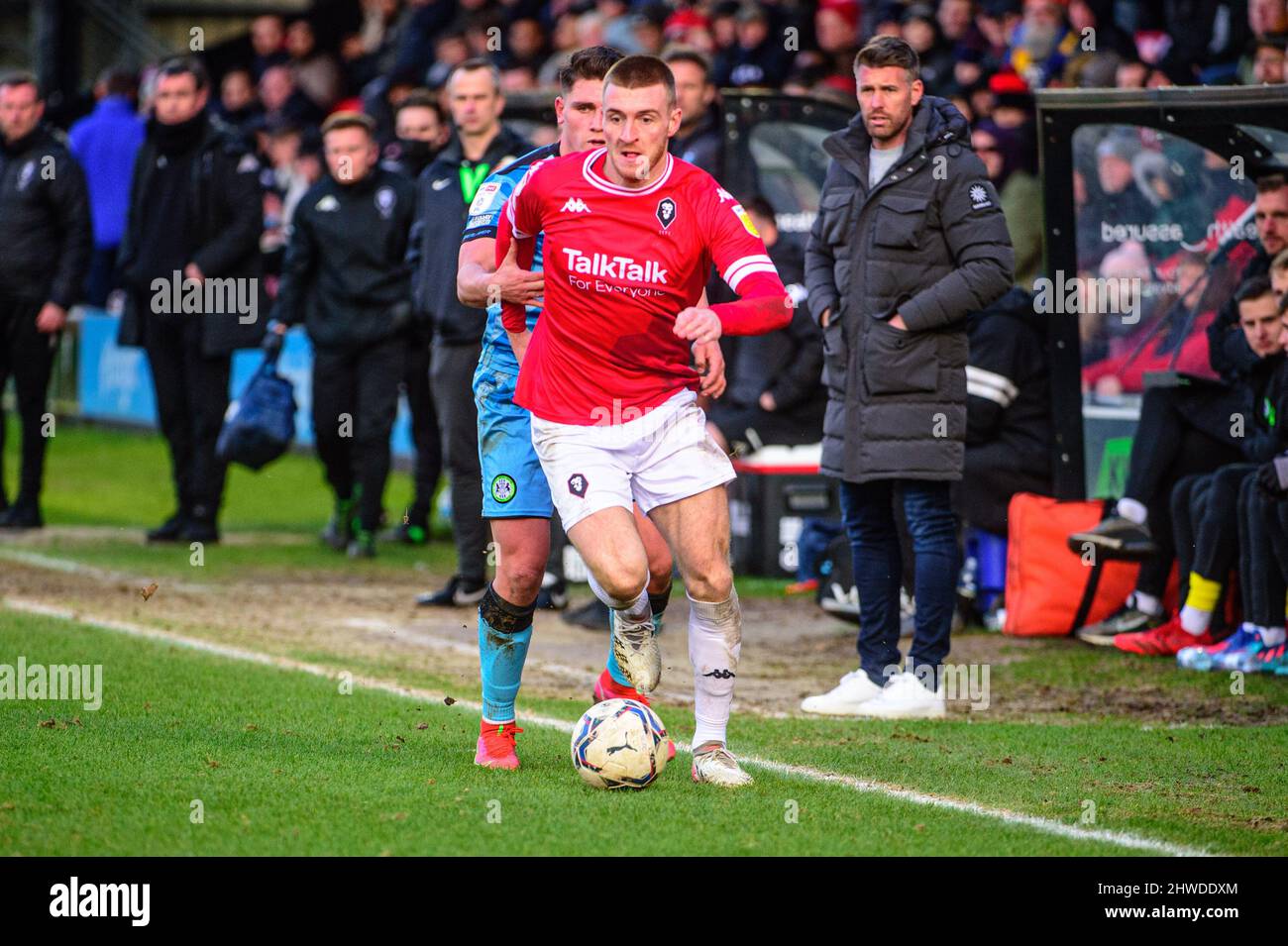 SALFORD, UK. MAR 5TH Ryan Watson of Salford City FC under pressure from Mathew Stevens of Forest Green Rovers during the Sky Bet League 2 match between Salford City and Forest Green Rovers at Moor Lane, Salford on Saturday 5th March 2022. (Credit: Ian Charles | MI News) Credit: MI News & Sport /Alamy Live News Stock Photo
