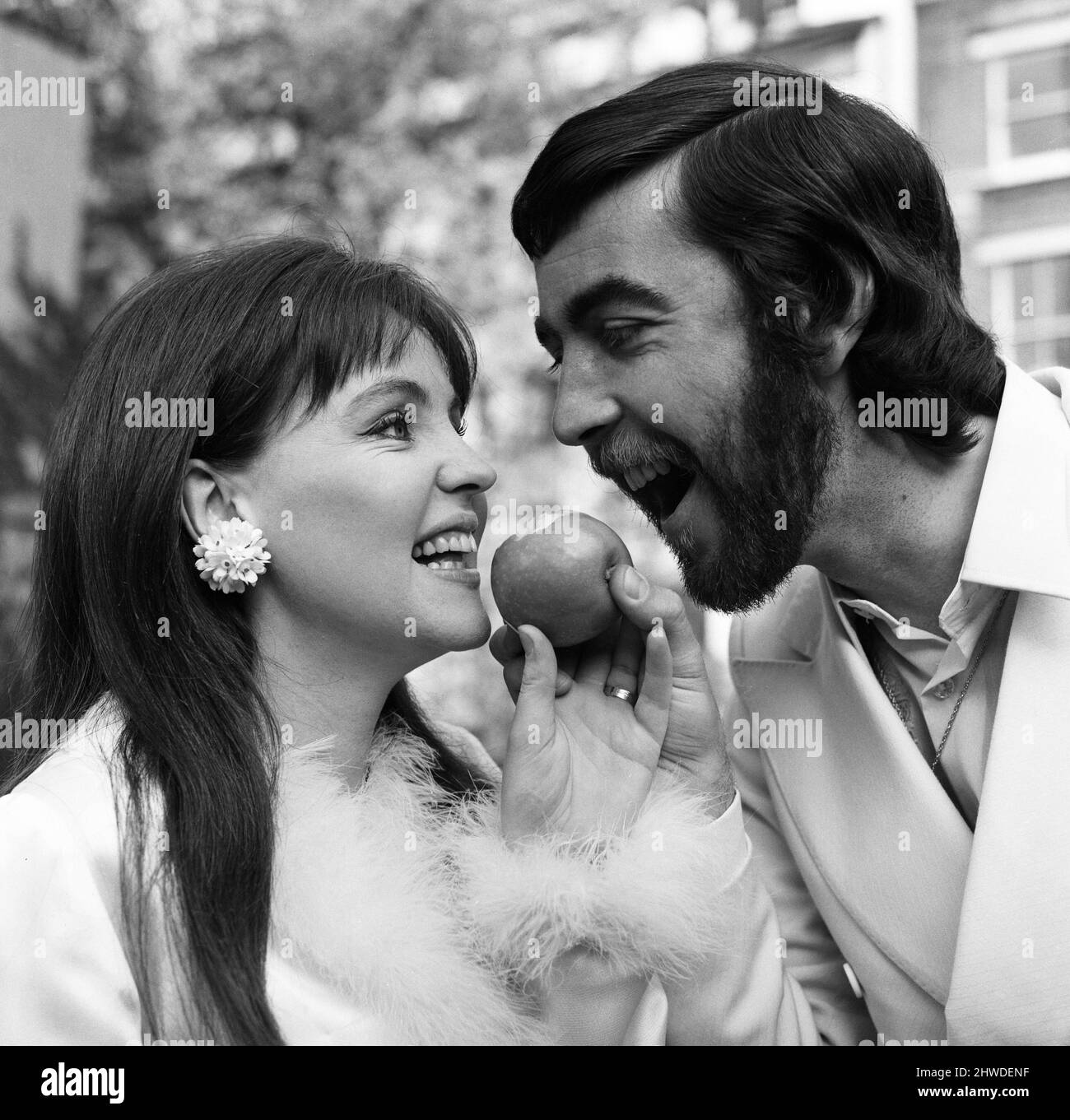 Actor John Alderton, who plays the school teacher in ITV series 'Please Sir' was today secretly married to actress Pauline Collins. They wed at Chelsea Registry Office. But tonight they arrive at the Apollo Theatre, as Pauline is the star of a play called 'The Happy Apple'. 22nd May 1970. Stock Photo