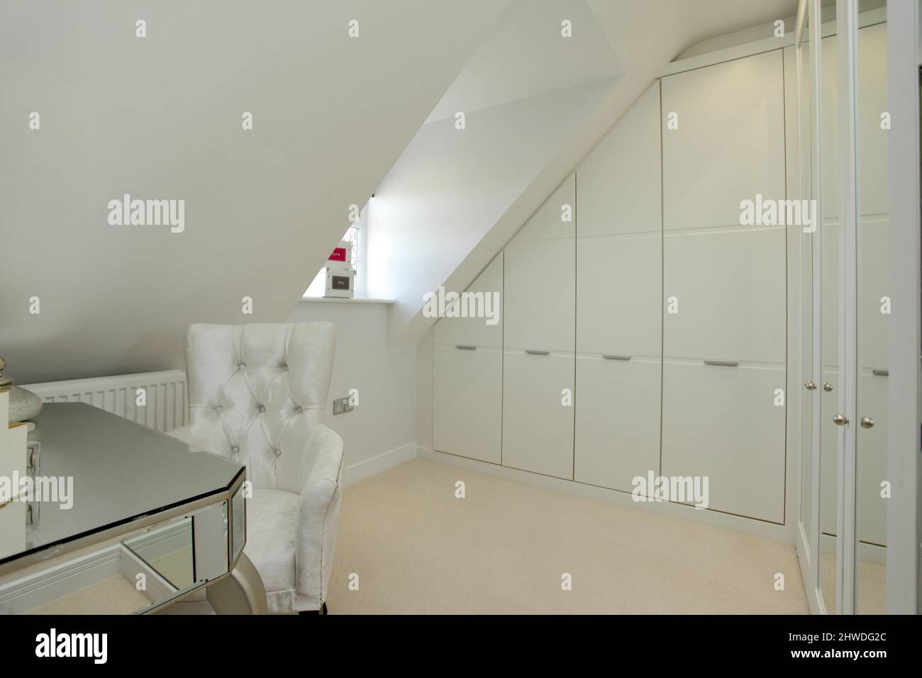 Changing room with fitted wardrobes in modern showhome. Stock Photo