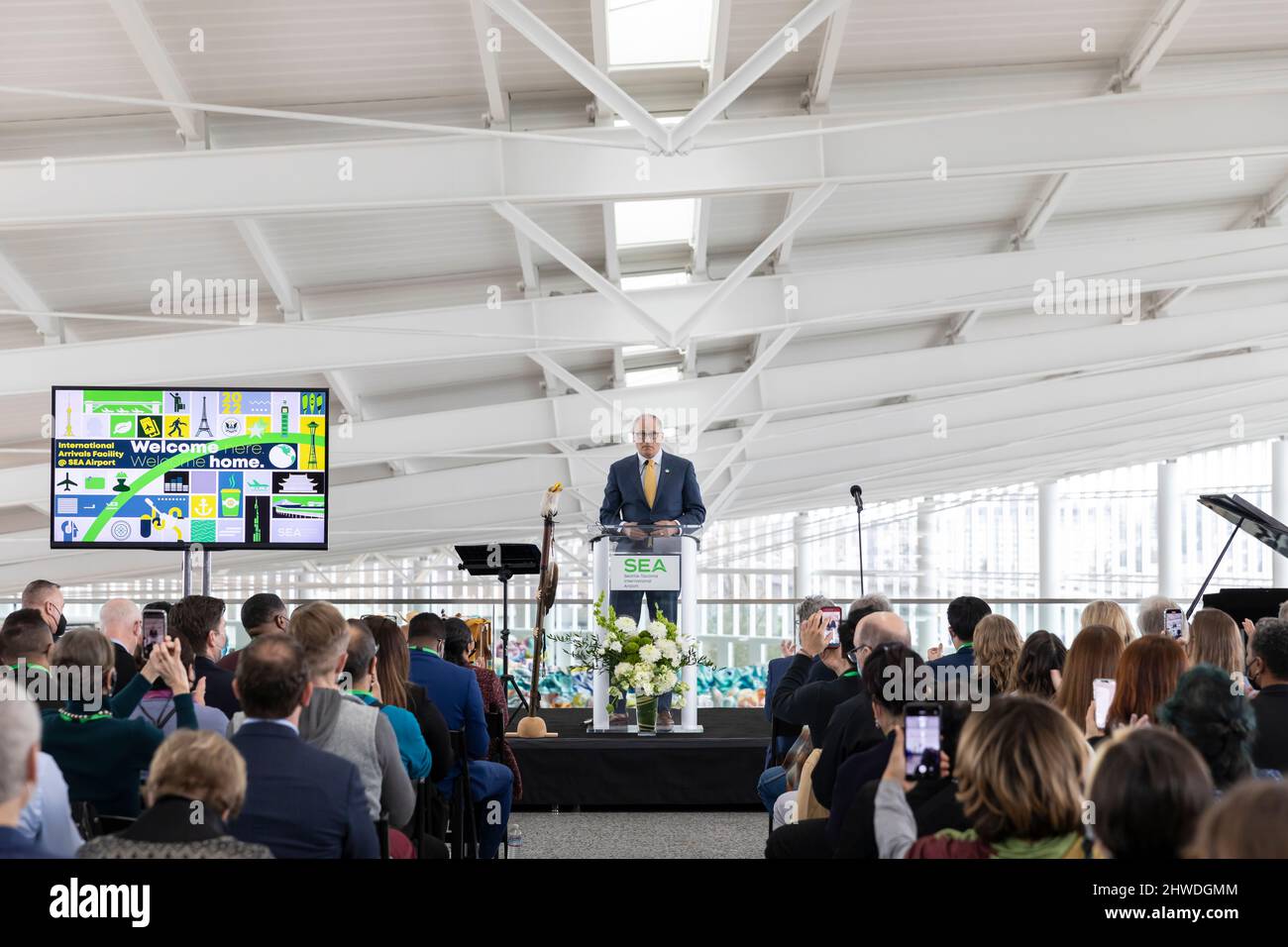 Washington governor Jay Inslee speaks to guests at a VIP reveal event for the new International Arrivals Facility at Seattle-Tacoma International Airp Stock Photo