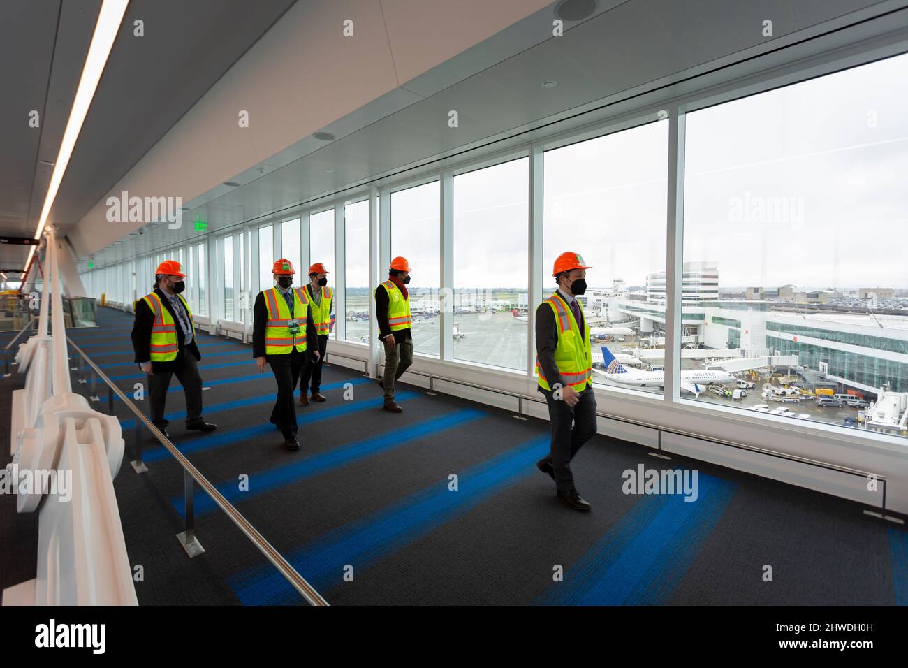 Dignitaries tour the aerial walkway during a VIP reveal event for the new International Arrivals Facility at Seattle-Tacoma International Airport in S Stock Photo