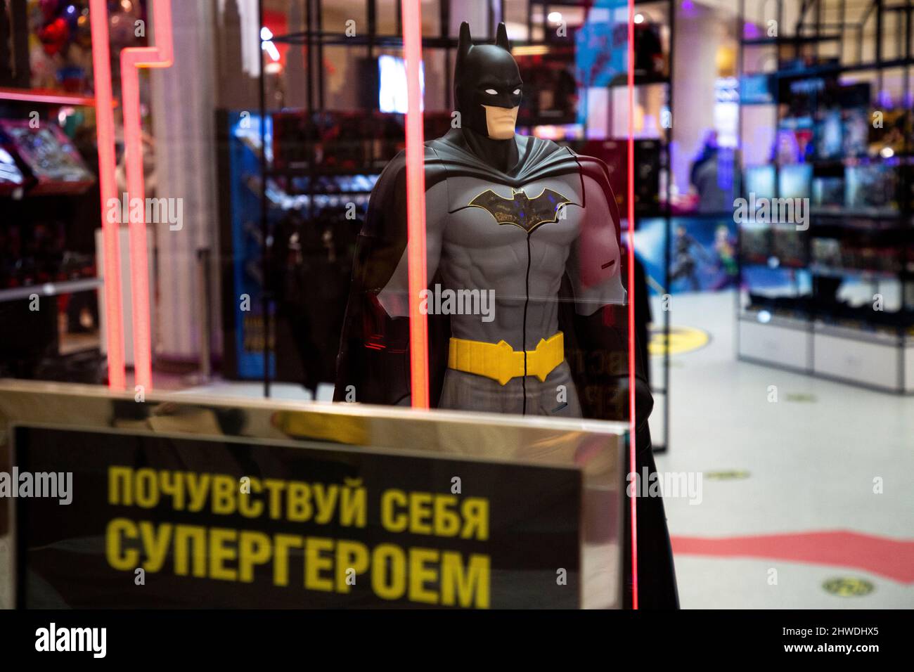 Moscow, Russia. 5th of March, 2022 View of interior of the Batman Pop-Up Store, the first official temporary mono-brand store in Russia dedicated to the famous character of the DC universe and The Batman movie, in the Central Children's Store on Lubyanka in central Moscow, Russia. The banner reads "Feel like a superhero" Stock Photo