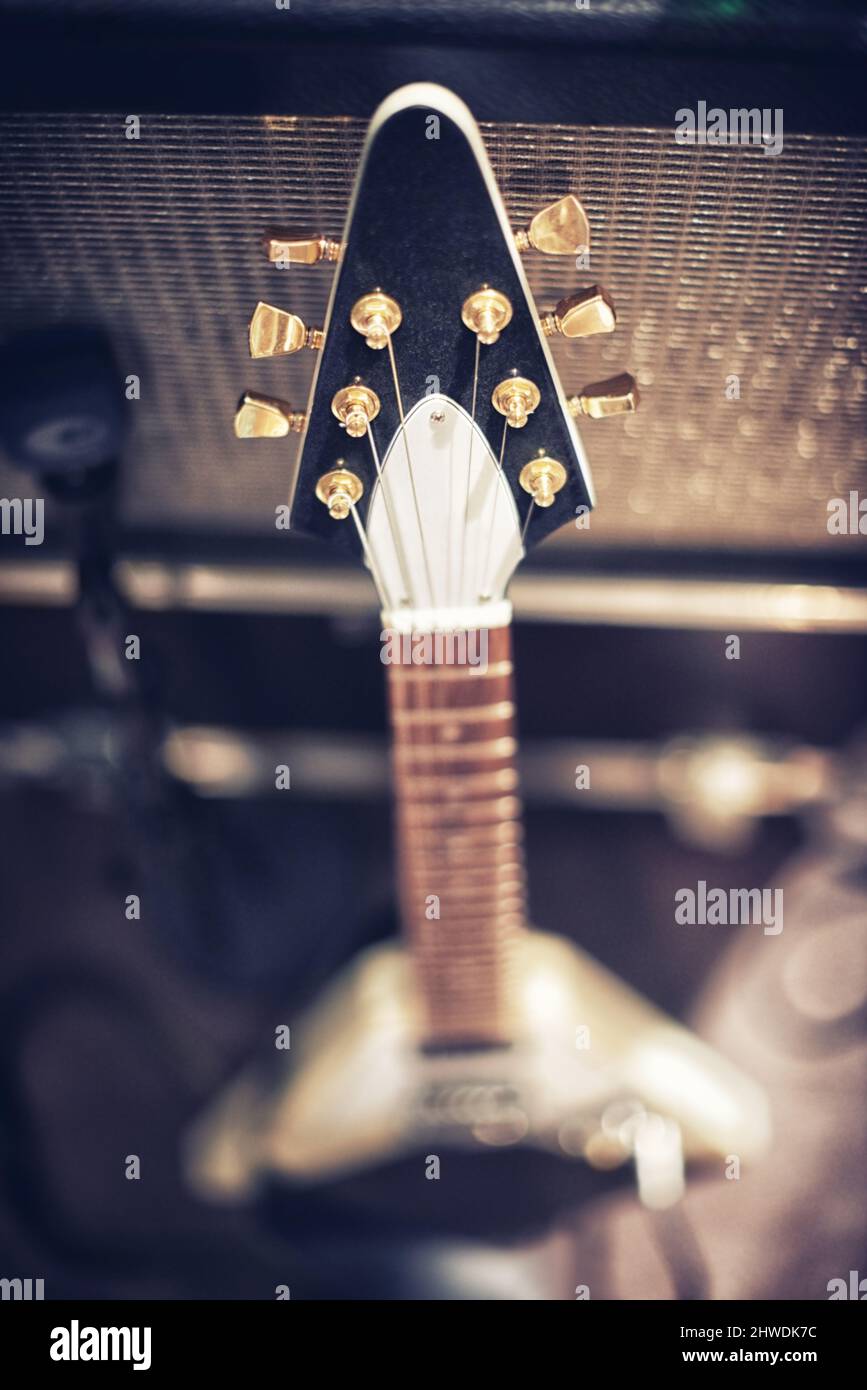 The guitar with the most sound. High angle view of a guitar leaning on