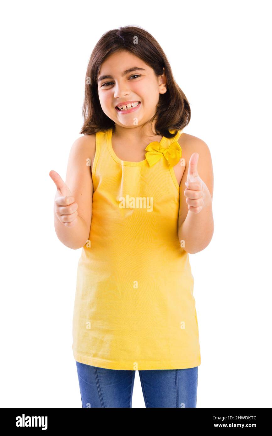 Studio portrait of a beautiful girl with thumbs up, isolated over white ...