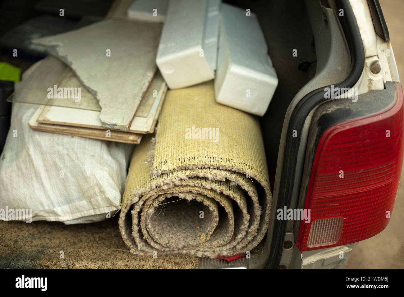 Pieces of foam and carpet in the car. Extra things in transport Stock