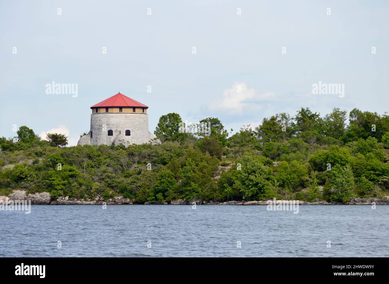 A Martello guard tower on the St. Lawrence River in Canada.  These were used as defence with canons inside to defend a potential American invasion. Stock Photo