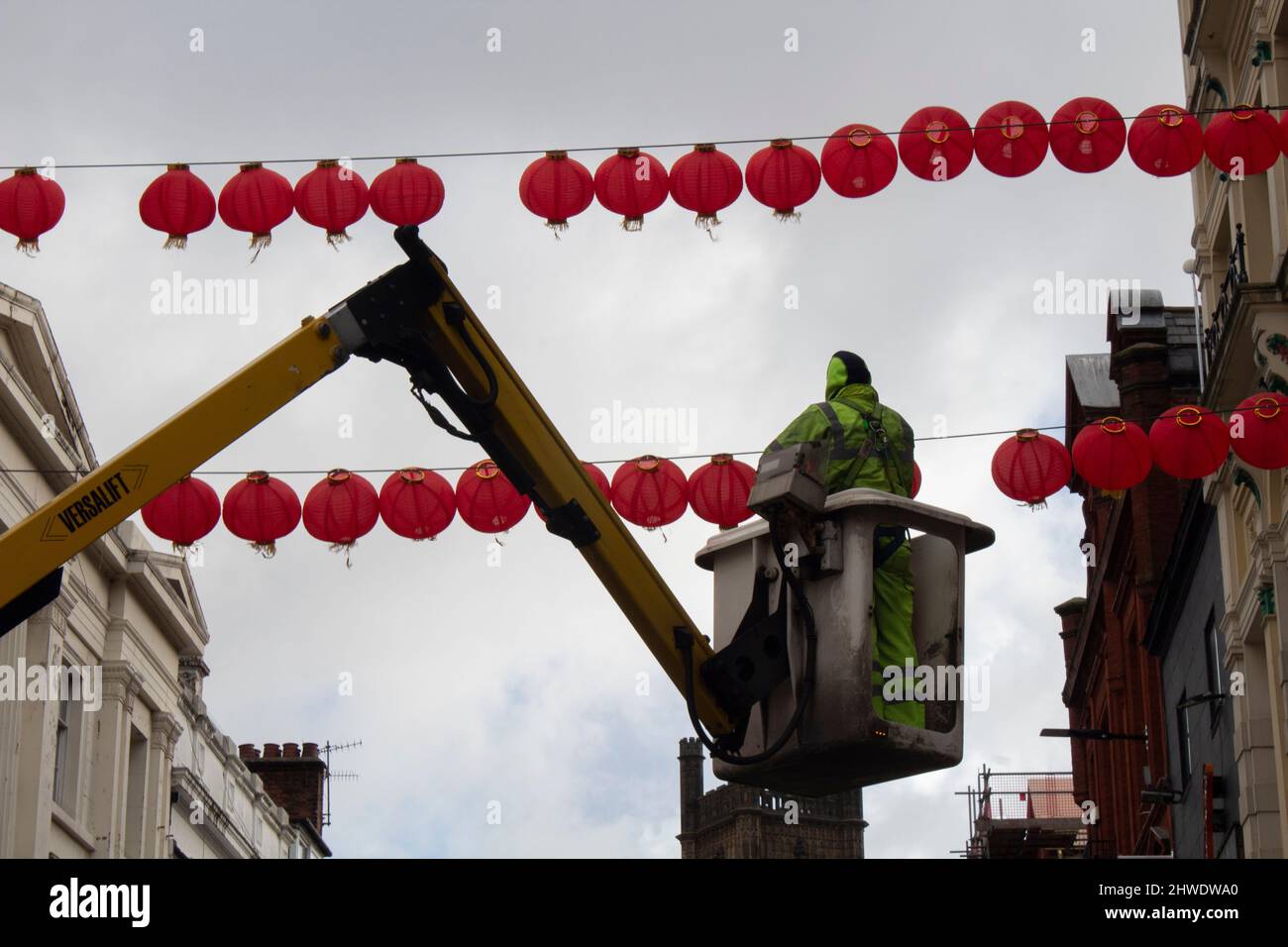 Chinese New Year lanterns being hung over Bold Street, Liverpool England UK Stock Photo