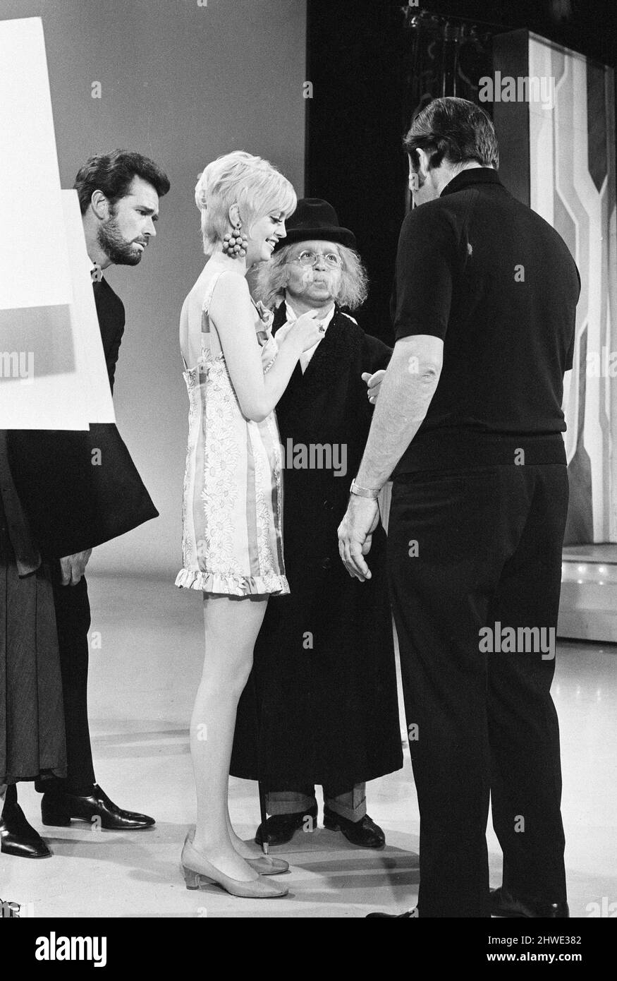 Rowan & Martin's Laugh-In, an American sketch comedy television program on the NBC television network, behind the scenes filming for series 2 episode 22, (aired Monday 3rd March 1969), in studio, Wednesday 15th January 1969. Our picture shows ... Goldie Hawn, American actress and regular performer, with Arte Johnson and James Garner. Stock Photo