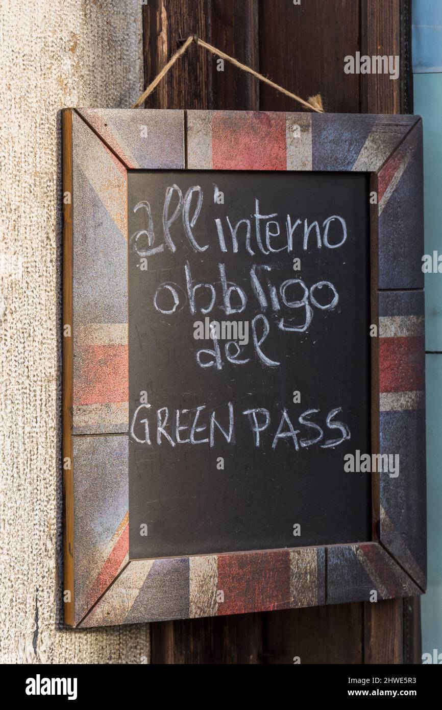 Sign at the entrance of local restaurant in Italy Green Pass required Stock Photo