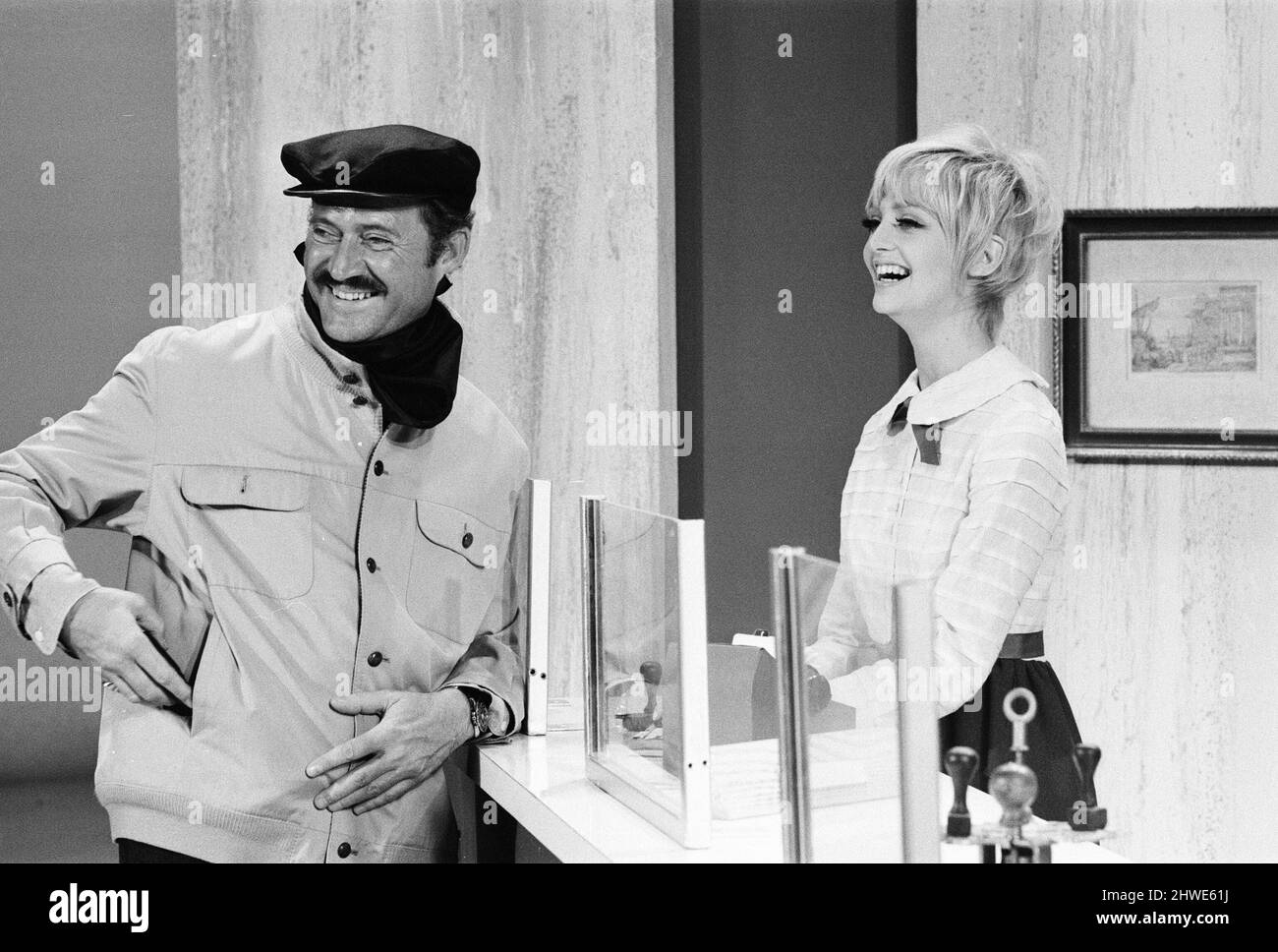 Rowan & Martin's Laugh-In, an American sketch comedy television program on the NBC television network, behind the scenes filming for series 2 episode 22, (aired Monday 3rd March 1969), in studio, Wednesday 15th January 1969. Our picture shows ... actors Dan Rowan and Goldie Hawn. Stock Photo