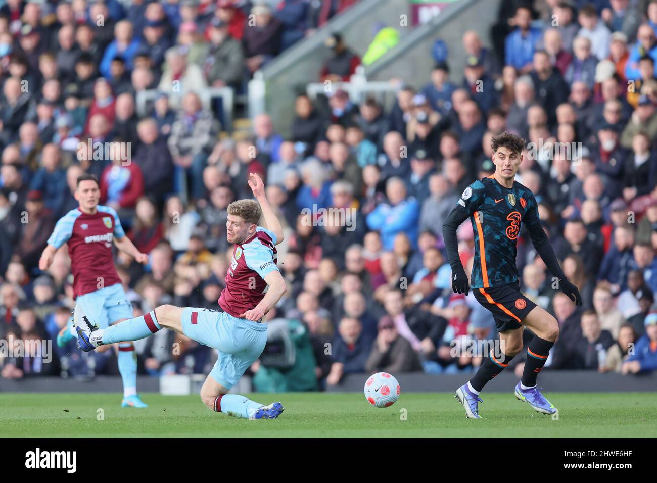 BURNLEY, UK. MAR 5TH Nathan Collins of Burnley slips allowing in Kai Havertz of Chelsea during the Premier League match between Burnley and Chelsea at Turf Moor, Burnley on Saturday 5th March 2022. (Credit: Pat Scaasi | MI News) Credit: MI News & Sport /Alamy Live News Stock Photo