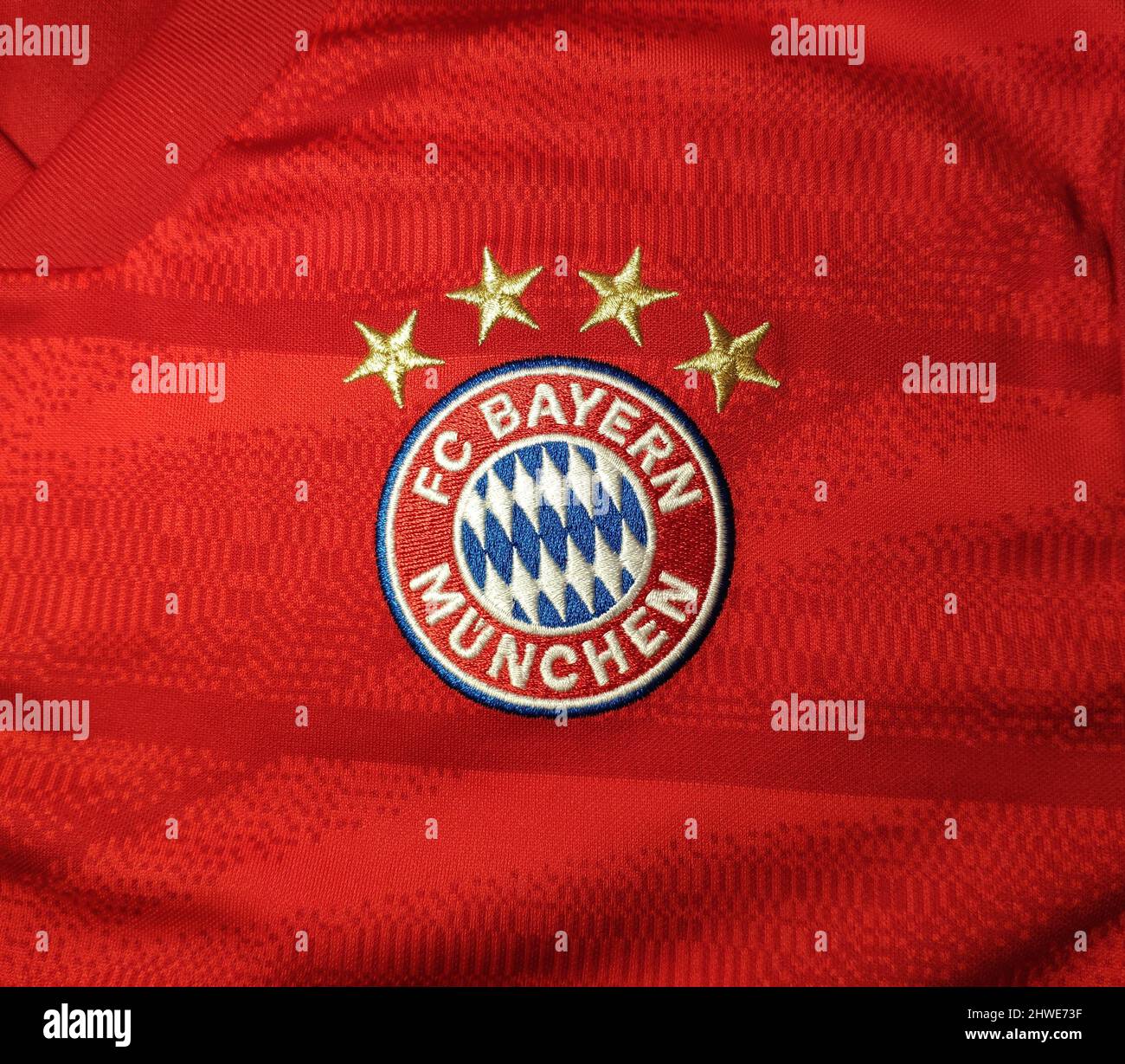 FC Bayern München (Munich) logo emblem on the red and white jersey background Stock Photo