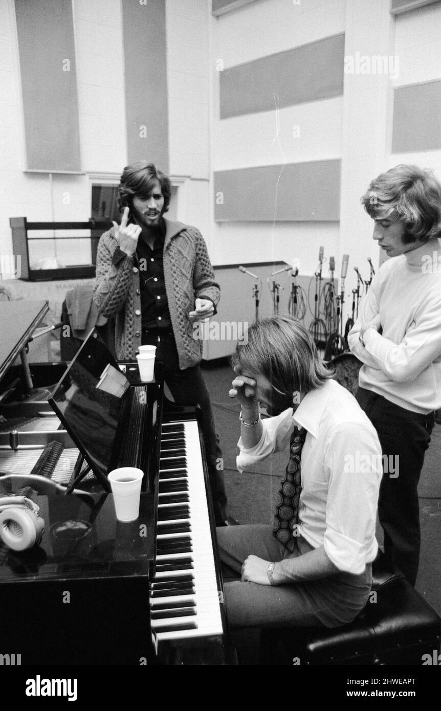 The Gibb Brothers a.k.a. The Bee Gees, newly reunited & back in the recording studio together, Soho London 3rd September 1970.  Hard at work on their first united venture in nearly two years.  Barry Gibb (24), who married former beauty queen Linda Gray 2 days earlier (1st sept.), broke his honeymoon to join his twin brothers Robin & Maurice Gibb in the studio. Stock Photo