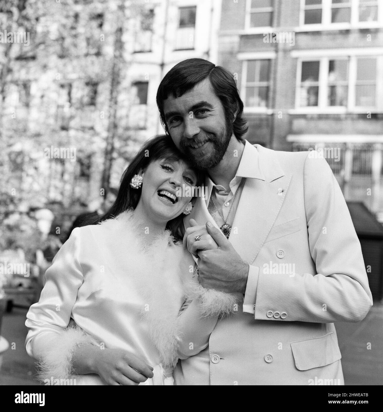 Actor John Alderton, who plays the school teacher in ITV series 'Please Sir' was today secretly married to actress Pauline Collins. They wed at Chelsea Registry Office. But tonight they arrive at the Apollo Theatre, as Pauline is the star of a play called 'The Happy Apple'. 22nd May 1970. Stock Photo
