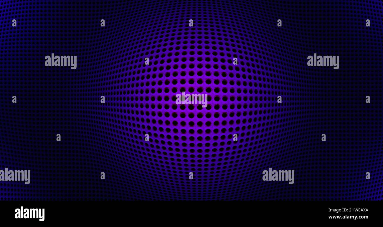 Spotlit perforated abstract tech geometric modern background close-up Stock Photo