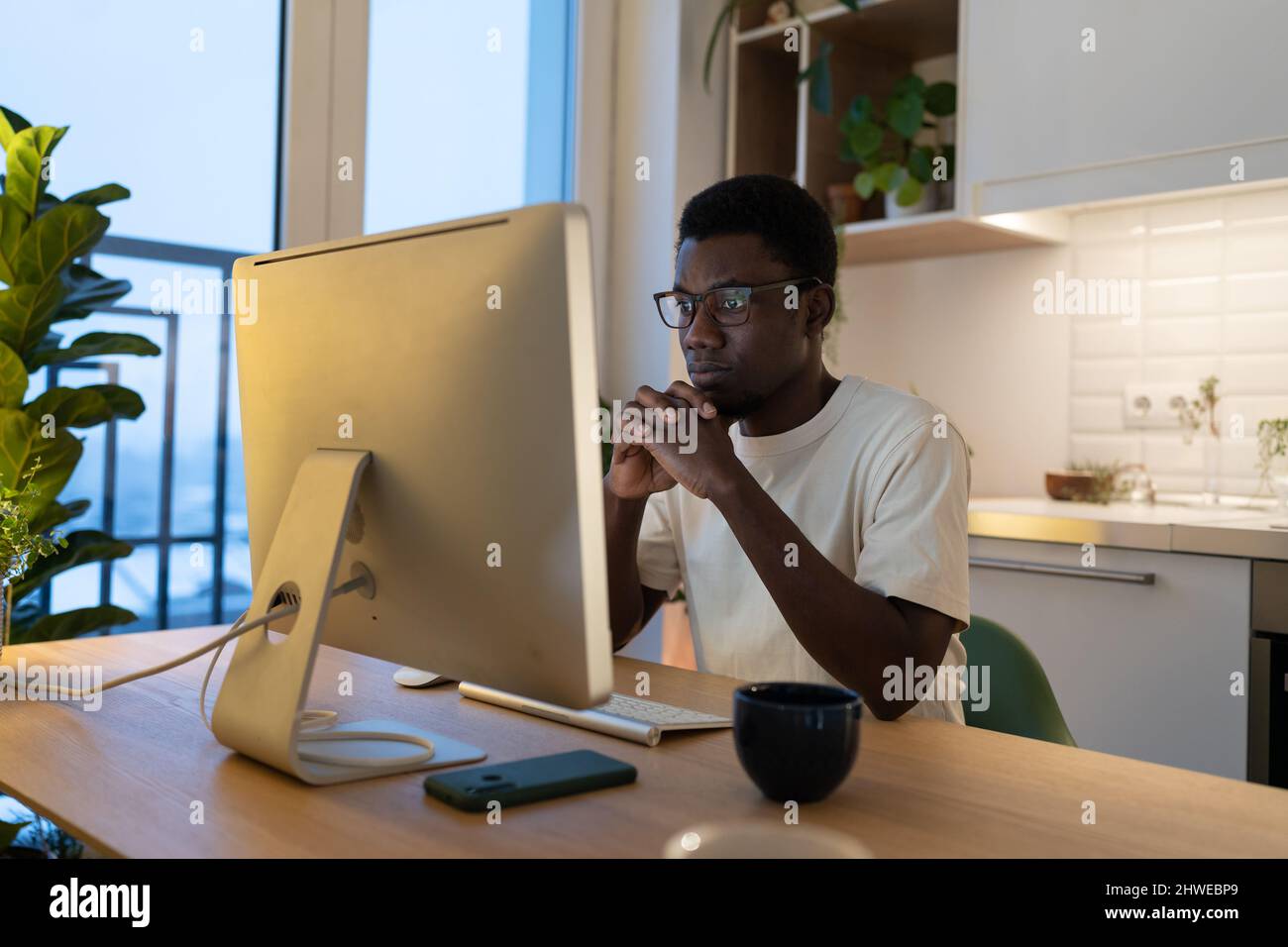 Concentrated software developer working on app coding from home focused ...