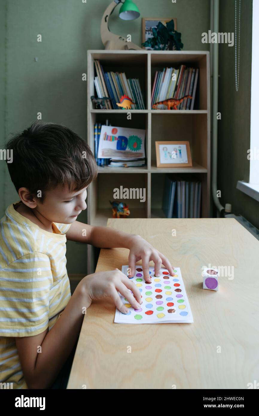 Child playing diy dot game for fingers Stock Photo Alamy