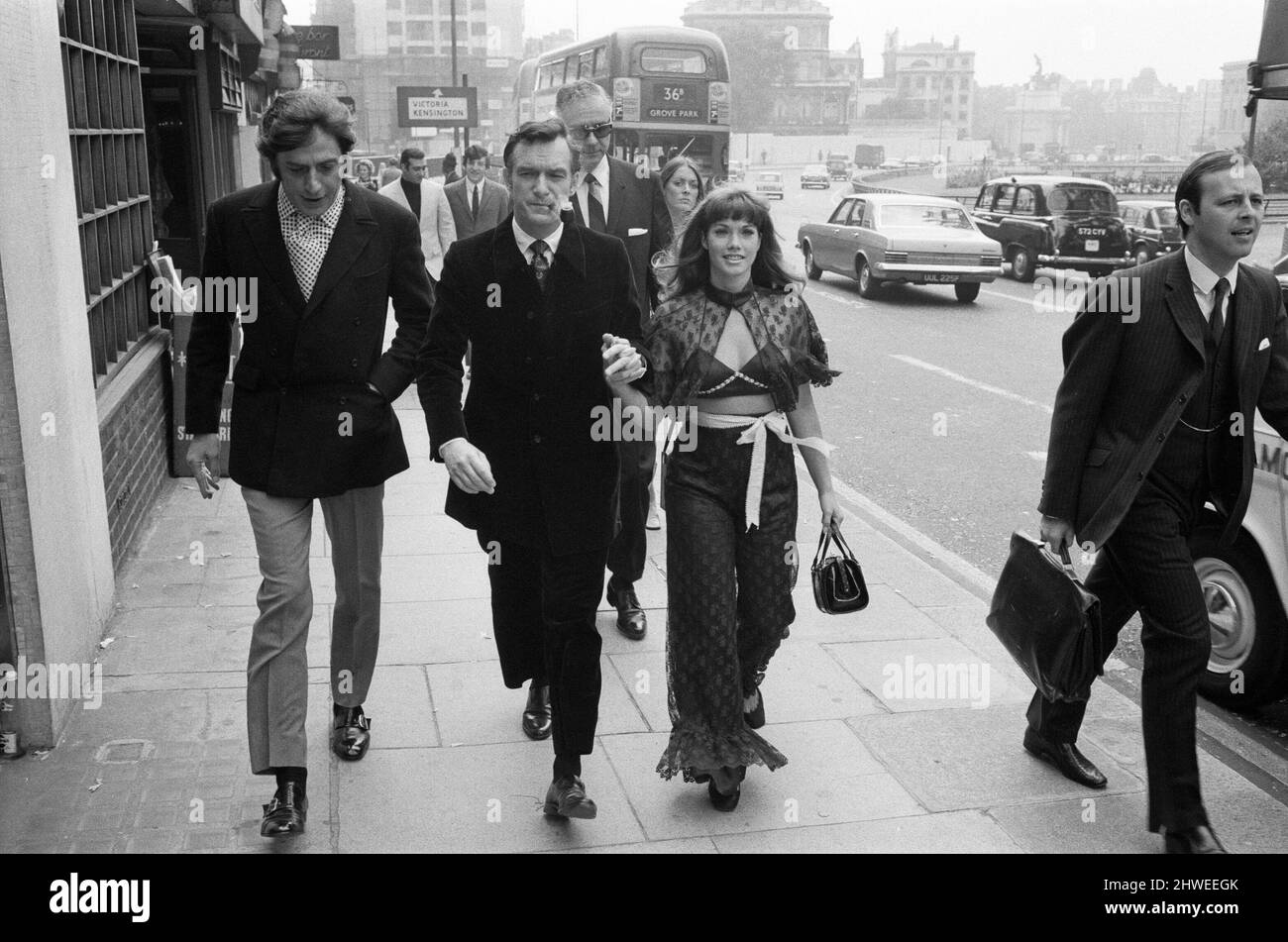 Hugh Hefner holds a press conference at the London Playboy Club to announce the formation of the Playboy film production company. Pictured as they arrive at the Playboy Club, Hugh Hefner with his girlfriend Barbara Benton, walking along Park Lane. 5th September 1969. Stock Photo