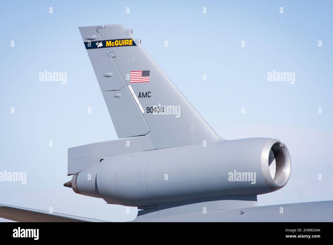 Tail and engine of KC-10 Extender cargo and tanker aircraft with blue sky Stock Photo