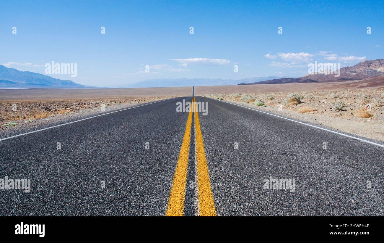 Endless road through the Death Valley National Park in america on a hot summer day Stock Photo