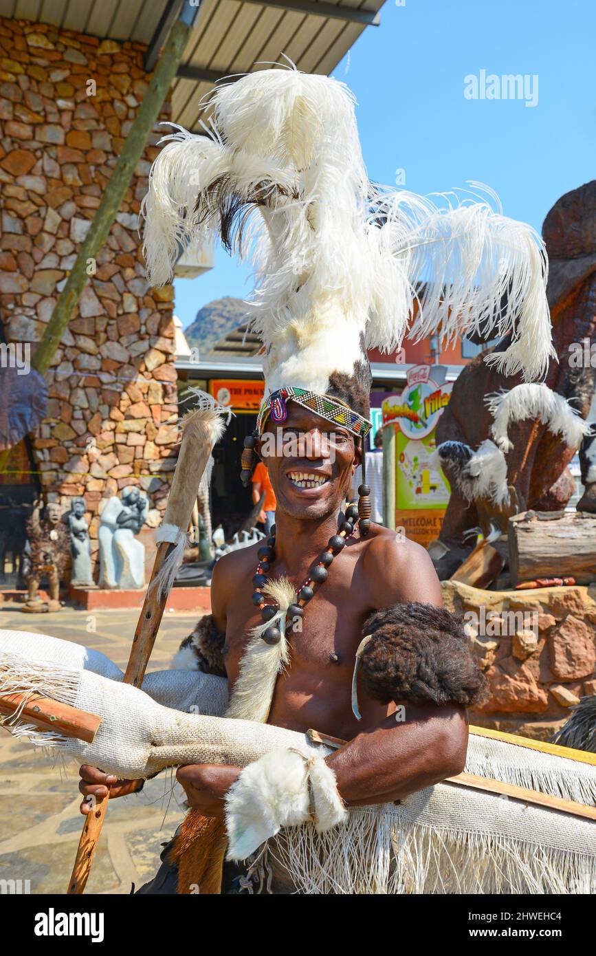 Zulu warrior with rickshaw at Chameleon Village, Hartbeespoort, North West Province, Republic of South Africa Stock Photo