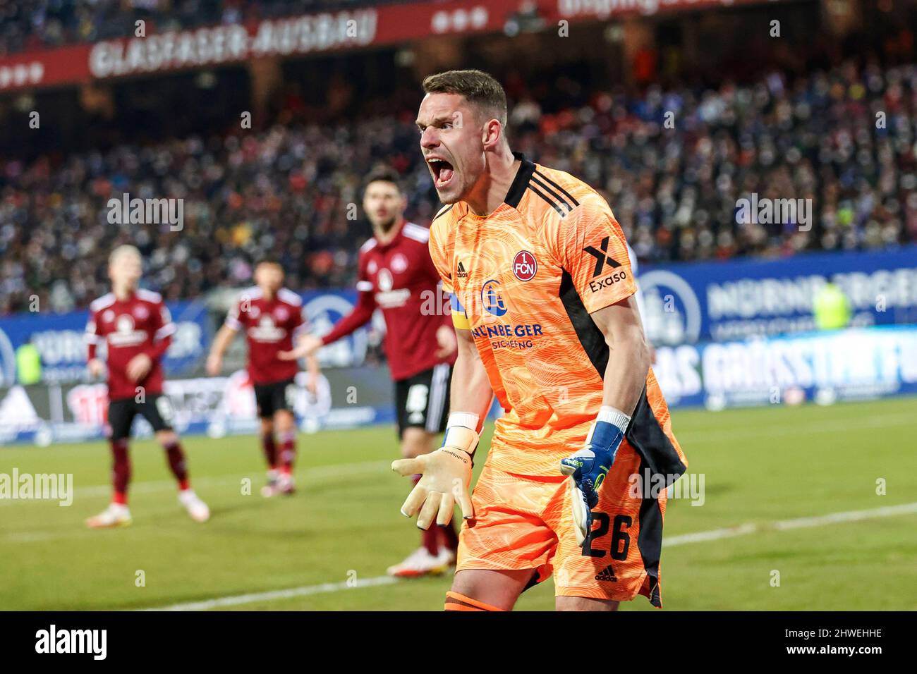 Nuremberg, Germany. 05th Mar, 2022. Soccer: 2. Bundesliga, 1. FC Nürnberg - Hamburger SV, Matchday 25, at Max-Morlock-Stadion, Nürnberg's goalkeeper Christian Mathenia scolds towards the linesman. Credit: Löb Daniel/dpa - IMPORTANT NOTE: In accordance with the requirements of the DFL Deutsche Fußball Liga and the DFB Deutscher Fußball-Bund, it is prohibited to use or have used photographs taken in the stadium and/or of the match in the form of sequence pictures and/or video-like photo series./dpa/Alamy Live News Stock Photo
