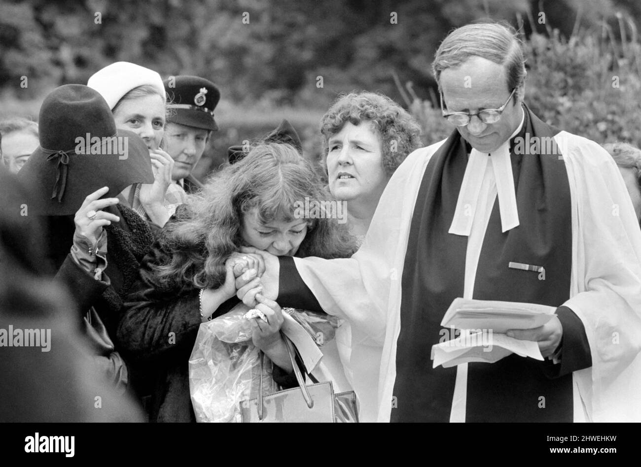 Rolling Stones: Brian Jones funeral. The rector of Cheltenham comforts a  weeping fan. 10 July 1969 Stock Photo - Alamy