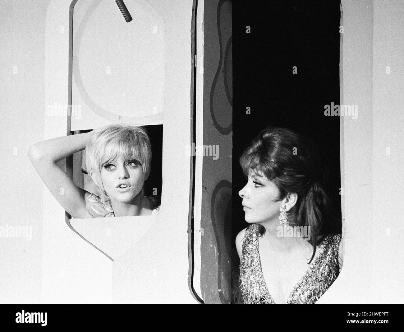 Rowan & Martin's Laugh-In, an American sketch comedy television program on the NBC television network, behind the scenes filming for series 2 episode 22, (aired Monday 3rd March 1969), in studio, Wednesday 15th January 1969. Our picture shows ... Goldie Hawn and Pamela Rodgers, American actresses and series regulars. Stock Photo