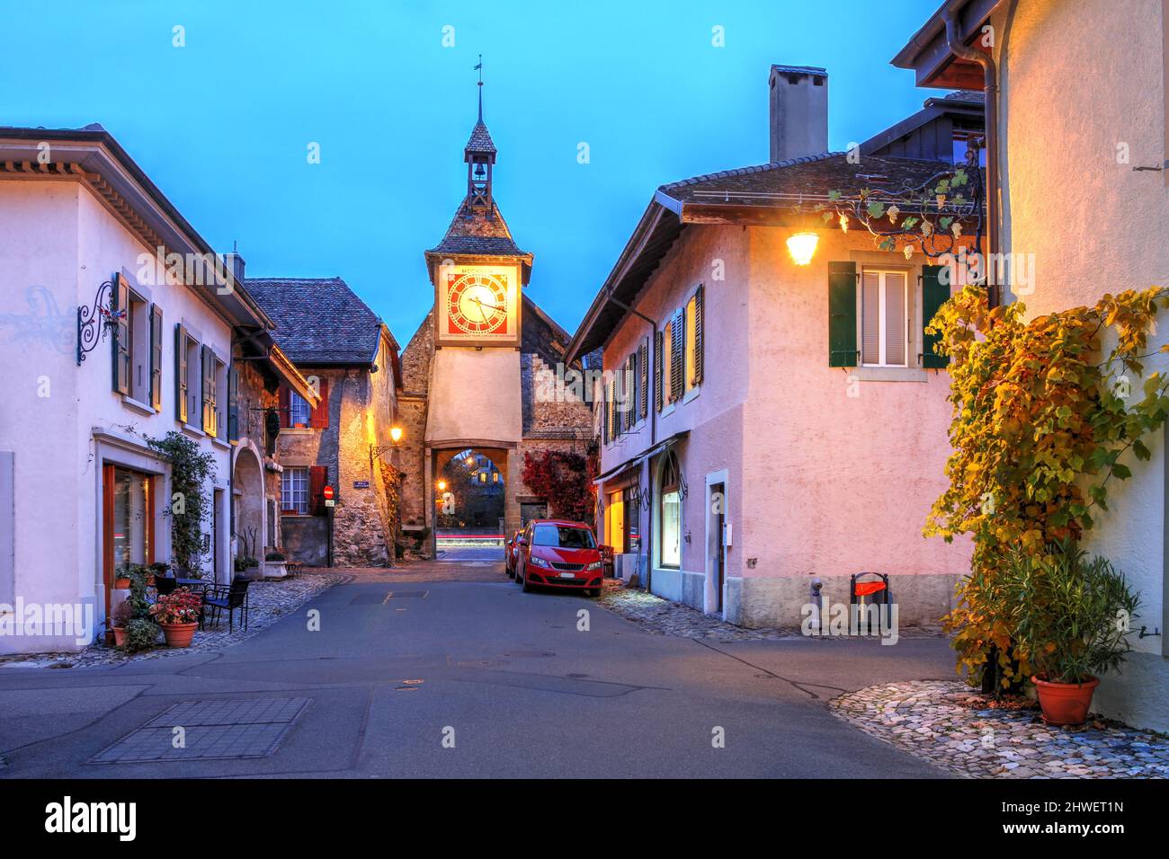 Night scene in the medieval town of Saint-Prex (St. Prex) in Vaud Canton, close to Morges in Switzerland featuring the main Town Gate. Stock Photo