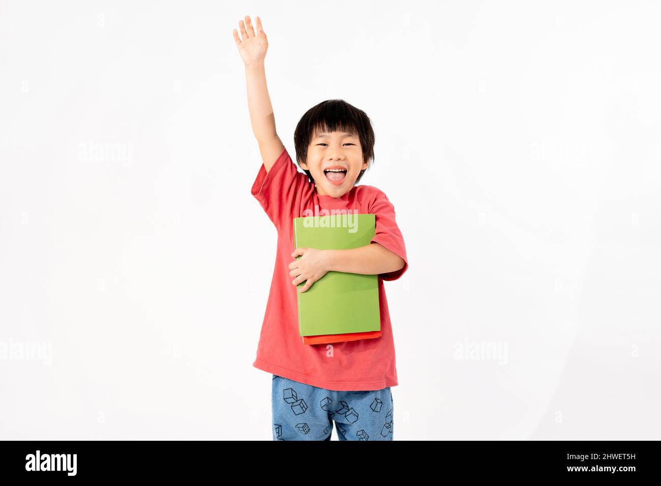 Portrait of Happy asian boy with books isolated on white background ...
