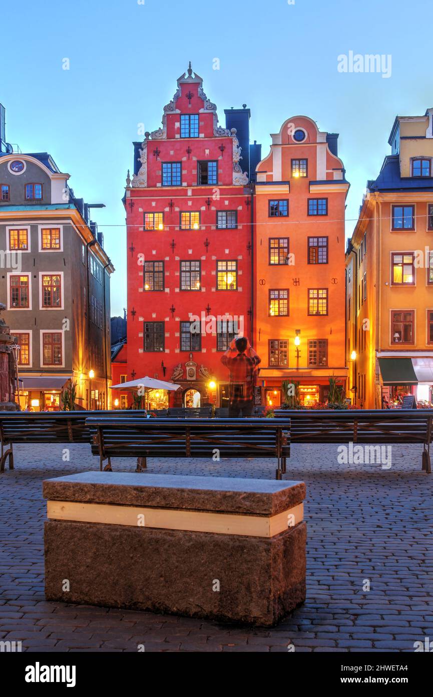 Stortorget square in the heart of old town of Stockholm (Gamla Stan), Sweden during a summer evening. Portrait composition with focus on two beautiful Stock Photo