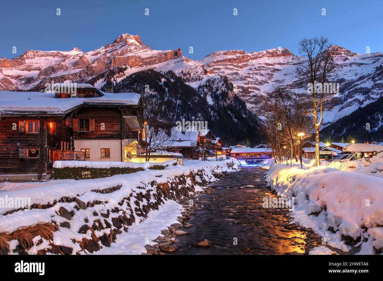 Sunset winter scene in Les Diablerets, a beautiful village and ski resort in the canton de Vaud, Switzerland. The Diablerets massif, part of the Berne Stock Photo