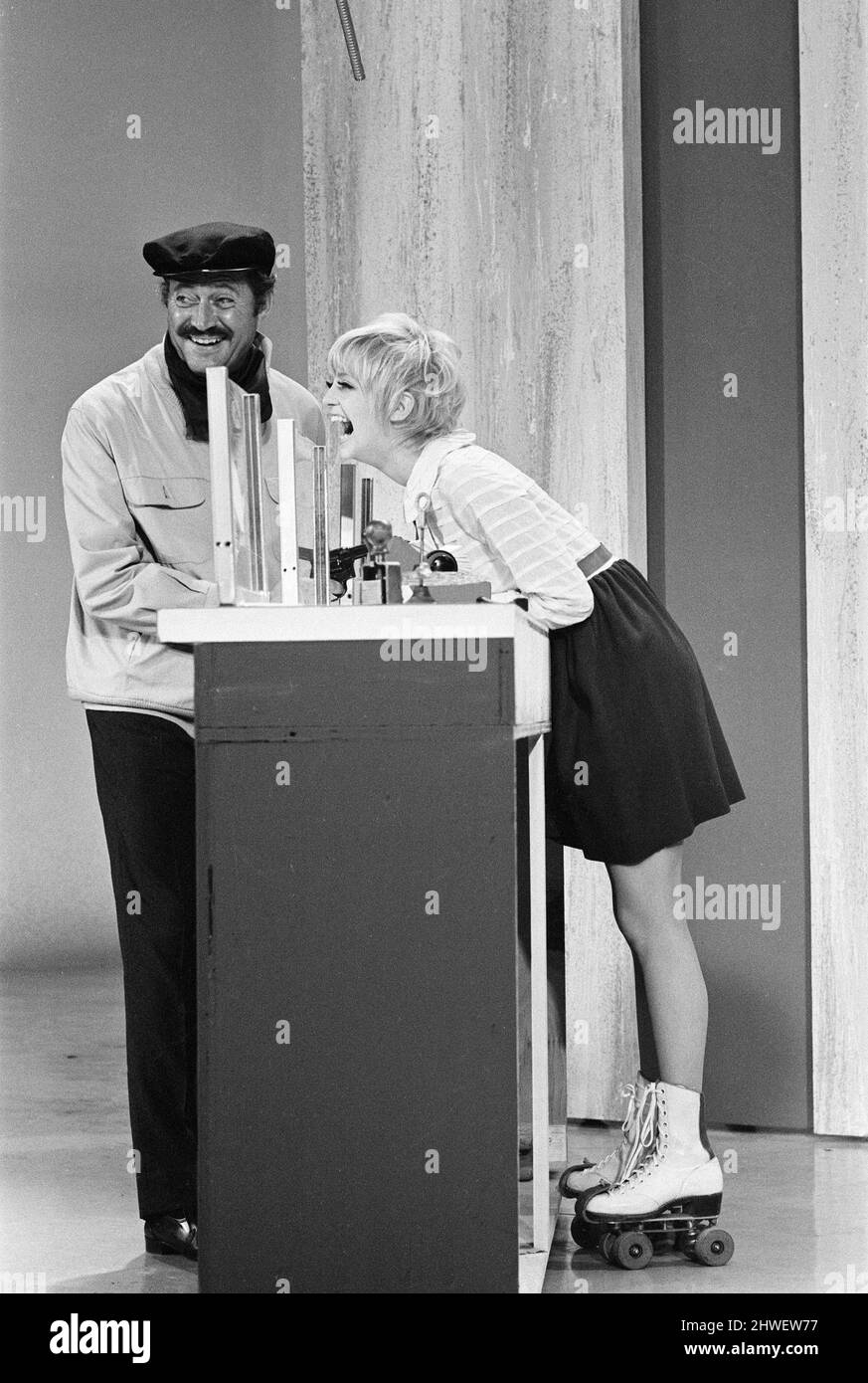 Rowan & Martin's Laugh-In, an American sketch comedy television program on the NBC television network, behind the scenes filming for series 2 episode 22, (aired Monday 3rd March 1969), in studio, Wednesday 15th January 1969. Our picture shows ... actors Dan Rowan and Goldie Hawn. Stock Photo