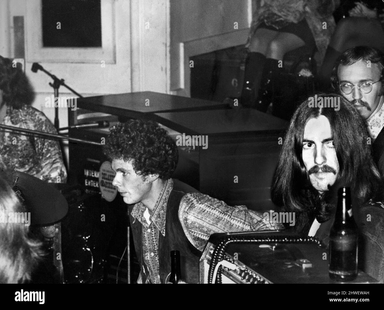 Beatle George Harrison makes his first concert appearance since 1966 - in Birmingham Town Hall.  For his rare appearance, George joined an American band, Delaney and Bonnie, who were part of a pop package concert at the hall.Jim Gordon  on drums, Bobby Whitlock (centre), George Harrison & Carl Radle behind him. 3rd December 1969 Stock Photo