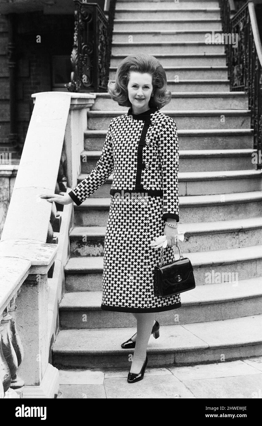 Lady Dartmouth, daughter of Alexander McCorquodale and  romantic novelist Dame Barbara Cartland, voted one of the 10 best dress ladies in the country. She is pictured at her home wearing a two piece midi costume in black and white, with a pair of new slimline shoes from France. 21st September 1970. Stock Photo