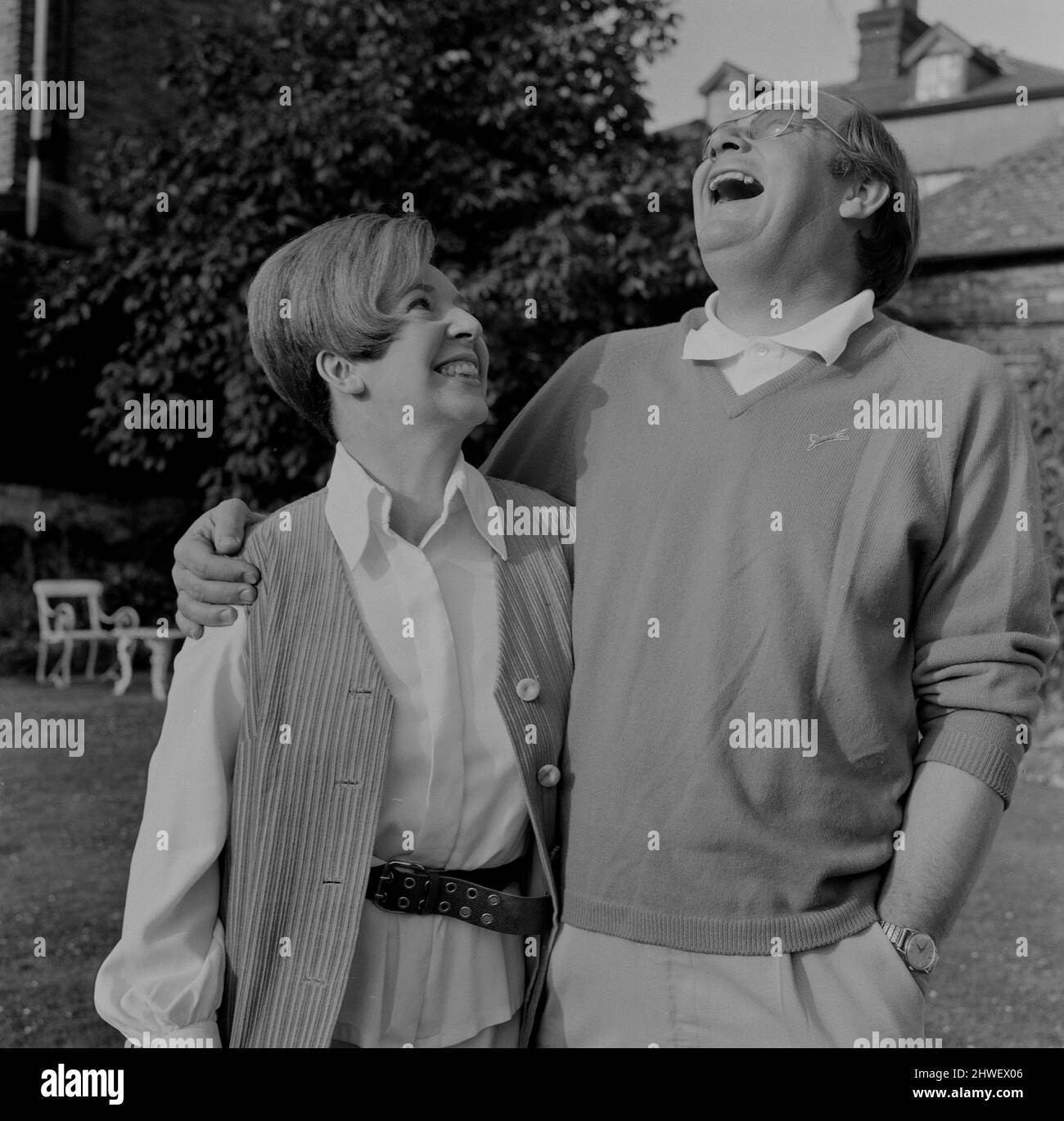 Cliff Mitchelmore and his wife Jean Metcalfe at their home in Reigate, Surrey. In a career spanning some 60 years, Cliff Michelmore anchored coverage of events including the Apollo moon landings and two general elections.  He presented BBC Television show Tonight from 1957 to 1965.  On 4 March 1950 he married Jean Metcalfe, a BBC announcer, who presented Two-Way Family Favourites in London while he was presenting the Hamburg link in the programme for the British Forces Broadcasting Service. The two did not meet face to face for six months, but after meeting they were quickly engaged and marrie Stock Photo