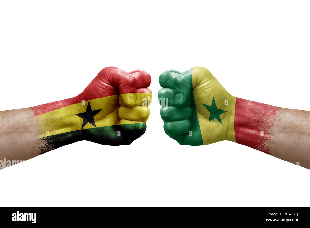 Two hands punch to each others on white background. Country flags painted fists, conflict crisis concept between ghana and senegal Stock Photo