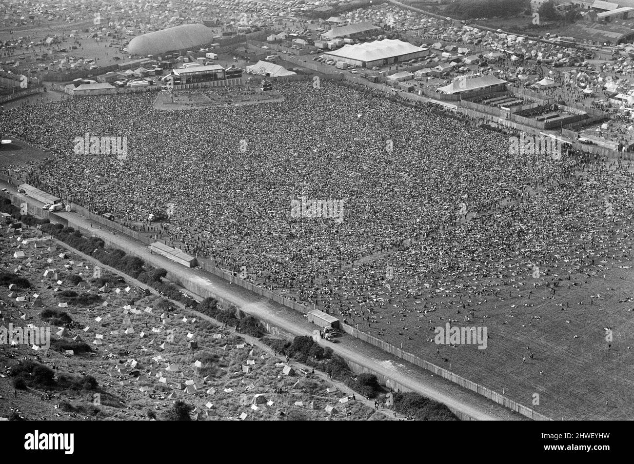 An aerial view of the 120,000 pop fans massed together at Freshwater on the Isle of Wight for the weekend pop festival. Pictures show the performance area and tented section. 28th August 1970. Stock Photo