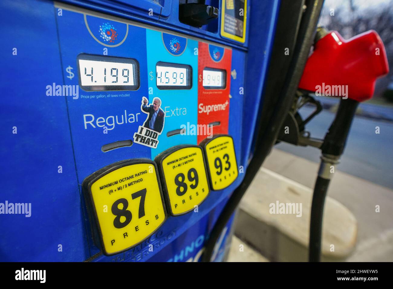 A sticker depicting President Joe Biden pointing at prices of gas is seen on a gas pump March 5, 2022, at Exxon gas station in Emmaus, Pennsylvania. Stock Photo