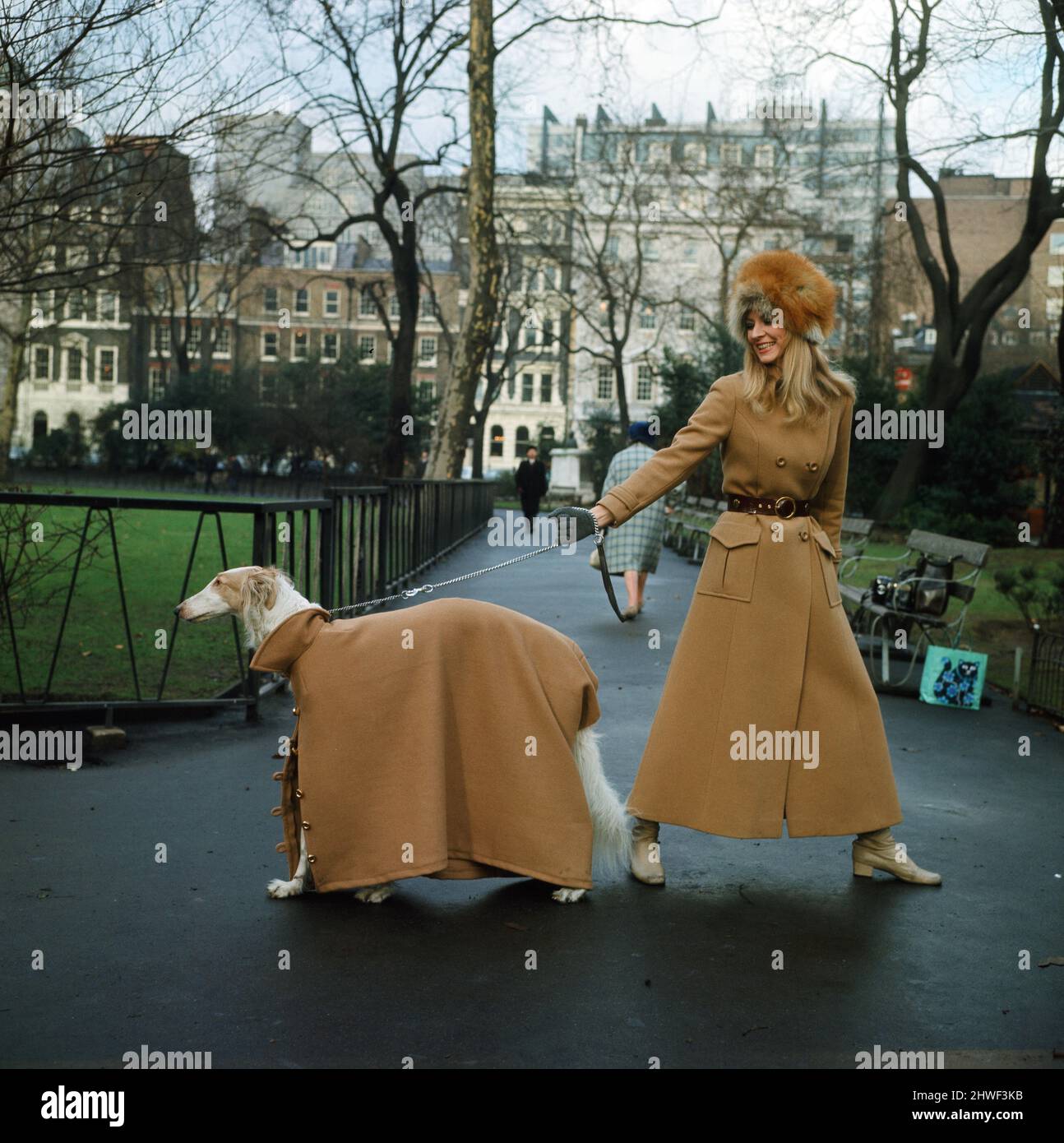 The first maxi coat for dogs gets its maiden outing in London with model Vicki Hodge and three-year-old Borzoi Sneshok Sokolova (known as Kika to her friends). Vicki's coat is by Elgee of London. January 1970. Stock Photo