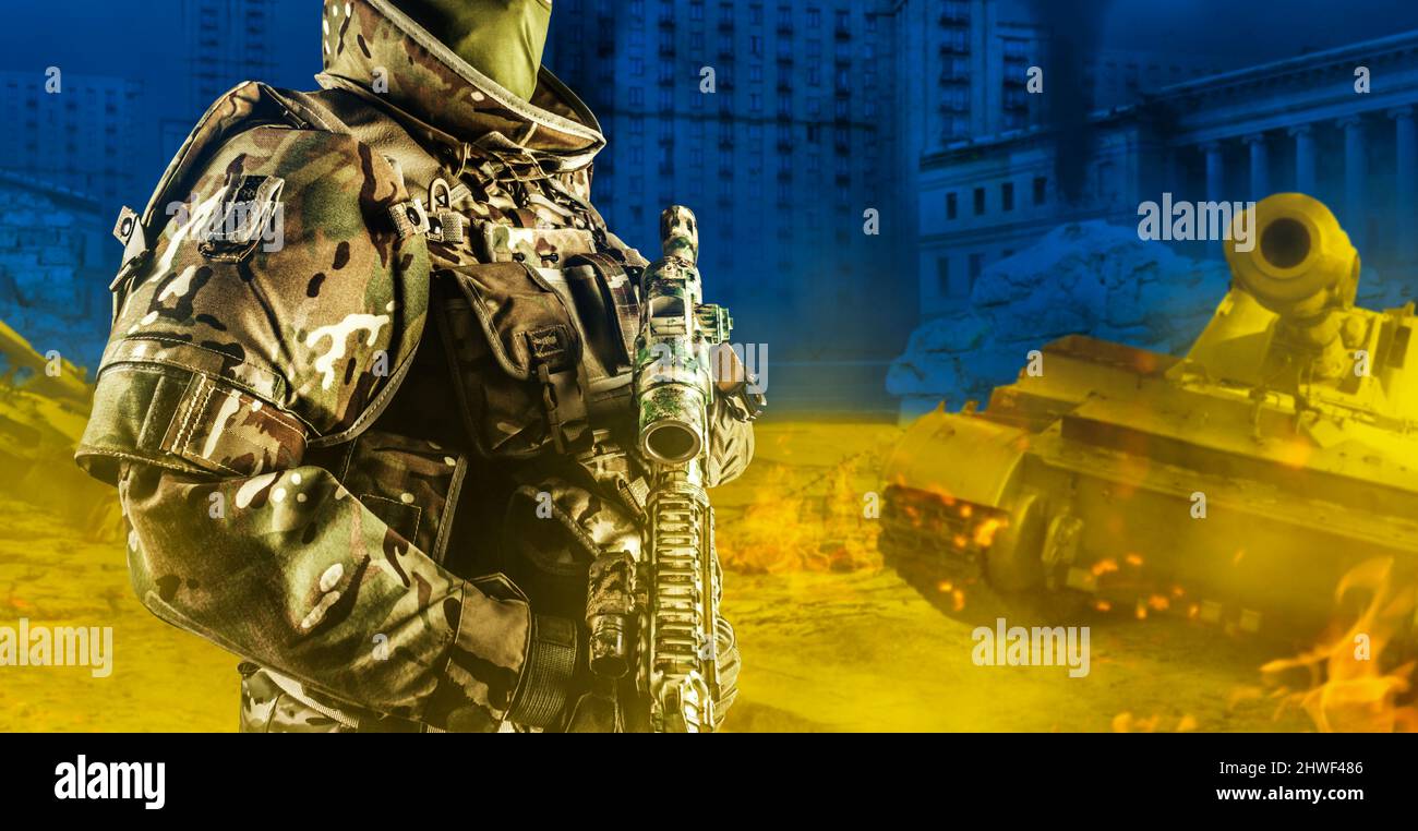 Photo of ukrainian soldier in full body armor holding rifle with scope ...