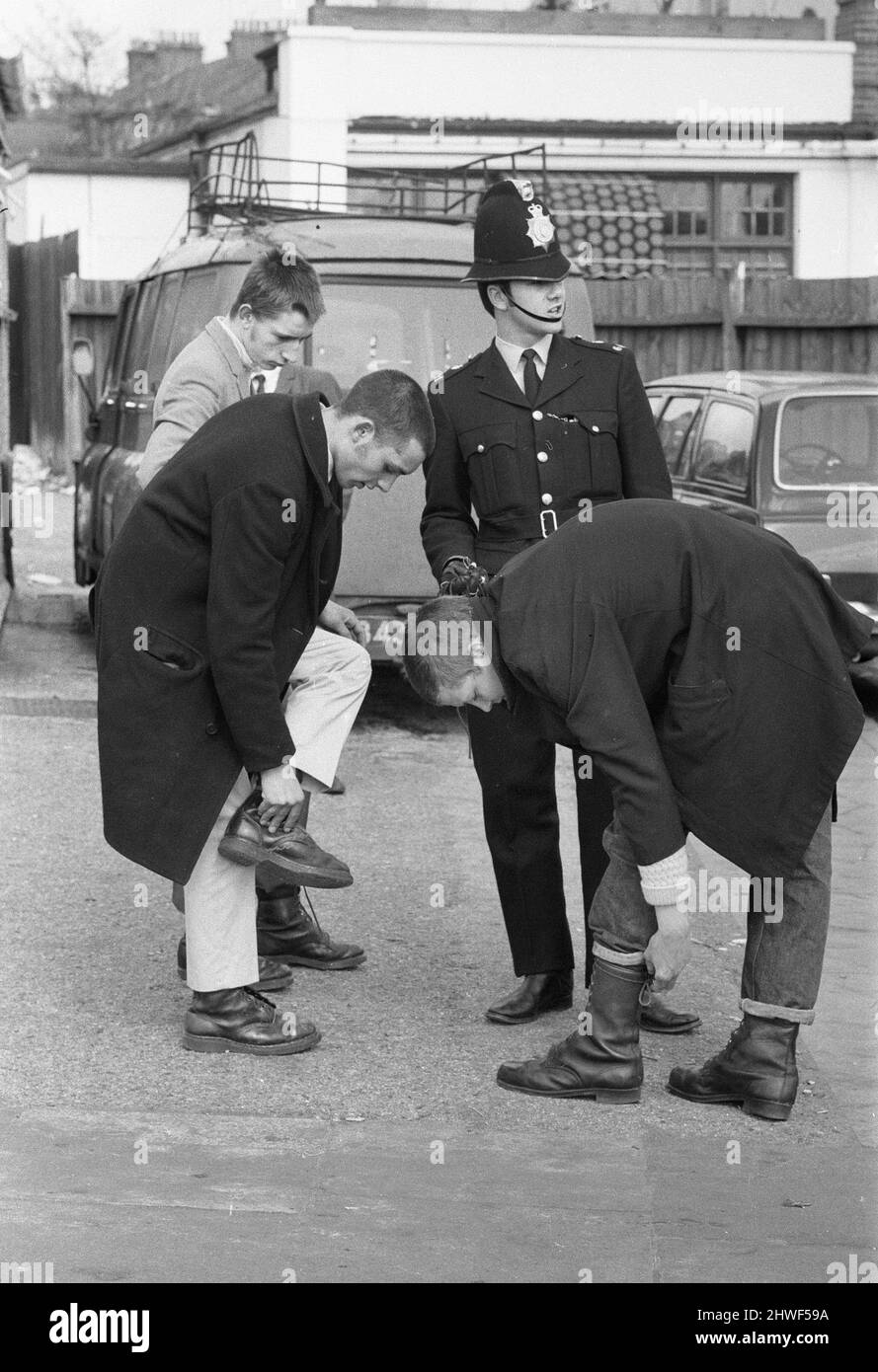 Police at Southend stopped any possible trouble makers, making them remove bootlaces, braces and belts  to be collected later that evening at the local place station. 30th March 1970. Stock Photo