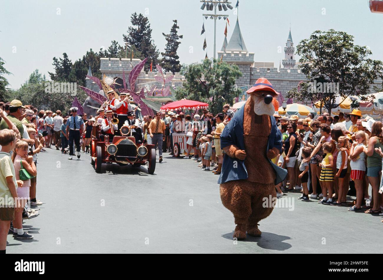 Scenes at the Disneyland theme park in Anaheim, California, United States.  The band playing accompanied by Disney characters during the Main Street parade. June 1970. Stock Photo